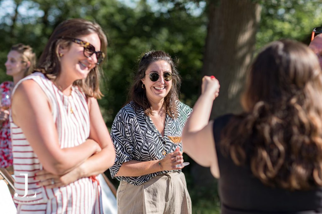 Guests chatting and laughing together during a networking session at the retreat.