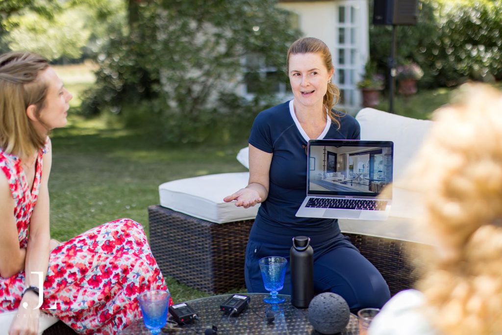 Speaker leading an interactive outdoor discussion at Belmond hospitality retreat.