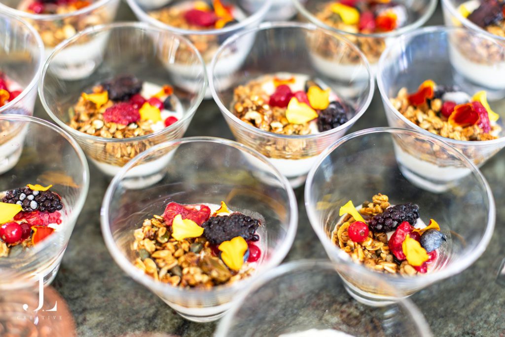 Fresh berry and granola breakfast pots prepared for guests at Belmond retreat.