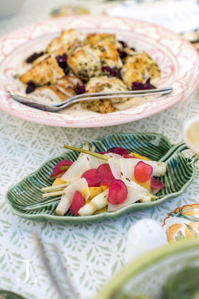 Seasonal dishes served during al fresco lunch at Belmond luxury hospitality retreat.