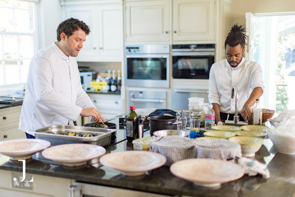 Executive Chef Sven Hanson Britt preparing seasonal dishes in the kitchen for lunch.
