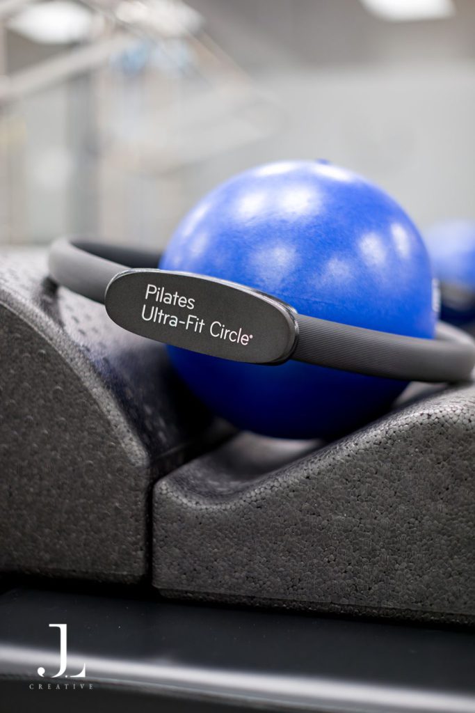 Close-up of Pilates Ultra-Fit Circle ring resting on a blue ball in a Surrey studio