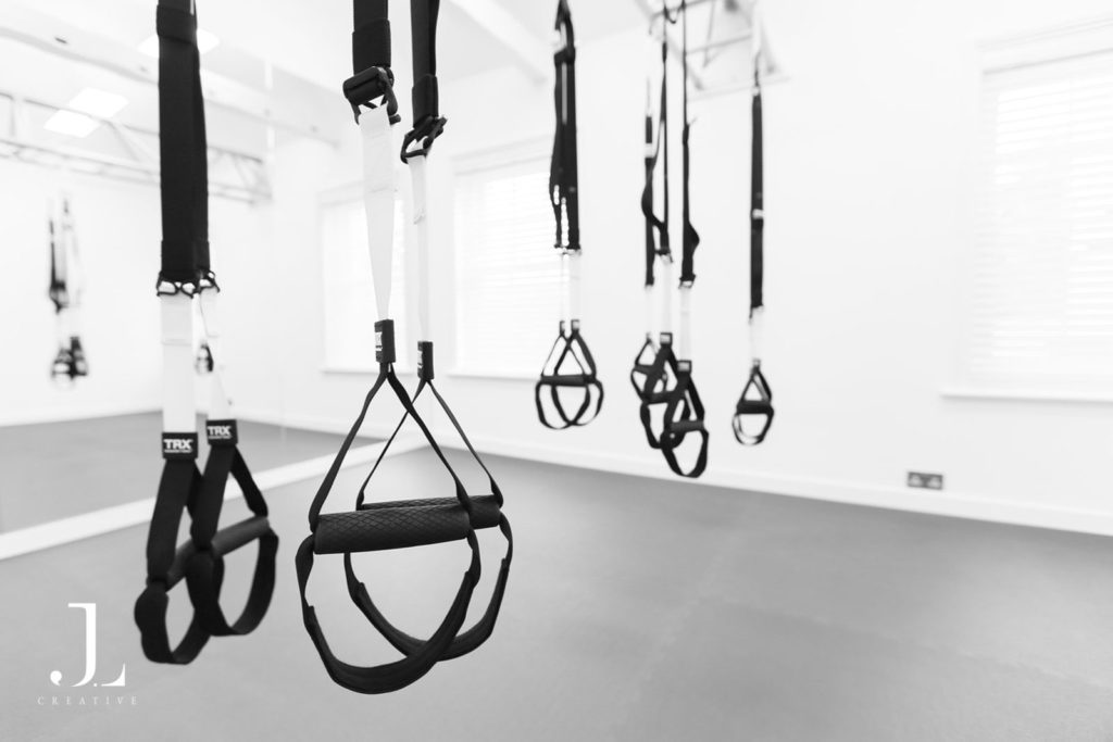 Close-up of suspension training straps during a Pilates studio photography session in Surrey.